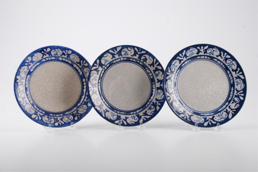 (3) Dedham Pottery Plates with Rabbit Border: Crackleware with rabbit border. Marked with "Dedham" insignia ((1) "Registered 1931") and embossed rabbits. Each 8 1/2 inches diameter. Condition: "Flea bites" to edge of (1)