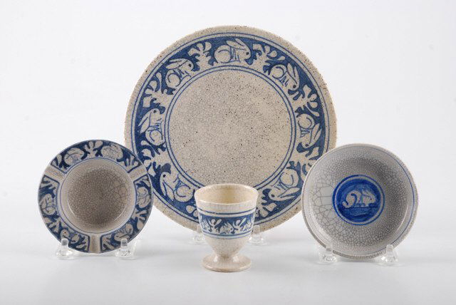(4) Uncommon Pieces of Dedham Pottery: Crackleware with rabbit border. Including: 7 1/2 inch hotplate (marked and stamped) , 3 3/4 inch ashtray (marked), 4 inch coaster (marked), and 2 1/2 inch (height) egg cup (not marked but signed D.P.)