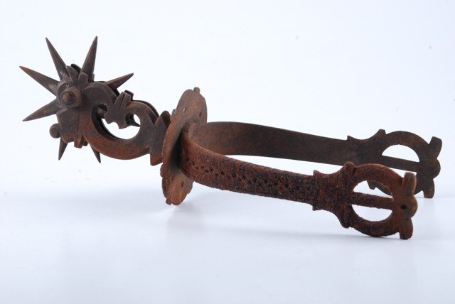 (19th c.) Cast Iron "Goucho" Cowboy Spur: Length 10 1/2 inches. Condition: Rust, (1) spur absent.