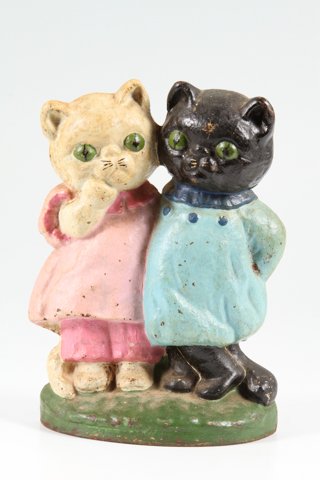 Cast Iron Kitten Doorstop: Height 7 inches Condition: Rust, (1) spur absent.