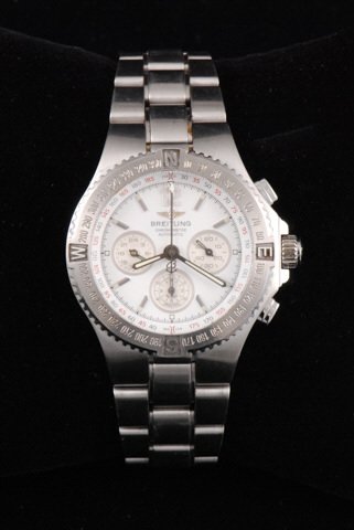 Men's Breitling Stainless Automatic Chronometer: 2 inches at its widest diameter. Dial diameter is approx. 1 3/8 inches. band width where it attaches to watch is 1 inch. Serial number A39363. Condition: Good