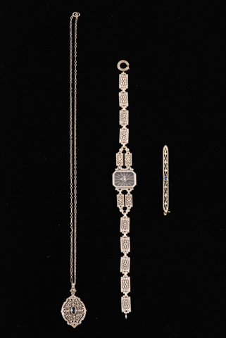 1920's White Gold Necklace, Bracelet and Pin: Including: 14K Gold 7 inch bracelet accented with a diamond, 10K gold 16 inch necklace set with a sapphire and a 10K gold 2 inch pin with sapphire accent. Condition: Good