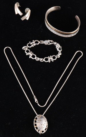 Group Sterling Jewelry: A pendant signed Denise Wallace, a sterling bracelet signed G Martima, a link bracelet and a pair of Mexican earrings Condition: Good