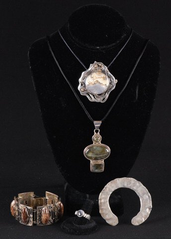 Group of Sterling Studio Jewelry: A pendant signed Bill Butler measures 2 1/4 inches long, a hardstone and sterling bracelet, a labradorite pendant and agate ring Condition: Good Size: 115.8 dwt