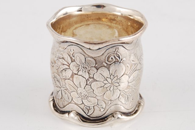 Silver Napkin Ring Embossed with Floral Motif: Stamped 610 M. diameter 2 inches. Condition: Good
