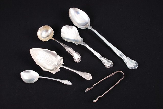 (5) Sterling Silver Serving Pieces: Including: (1) Gorham stuffing spoon, ( 1) Nelson Davis ladle, (1) Daniel Low sugar, (1) Shreve Crump and Low pie server, (1) Gorham berry spoon. (14.2 troy ounces). Together with an unmarked pair of 