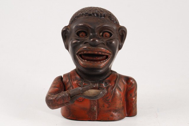 Black Americana Mechanical "Jolly N-----r Bank": Height 6 1/2 inches.