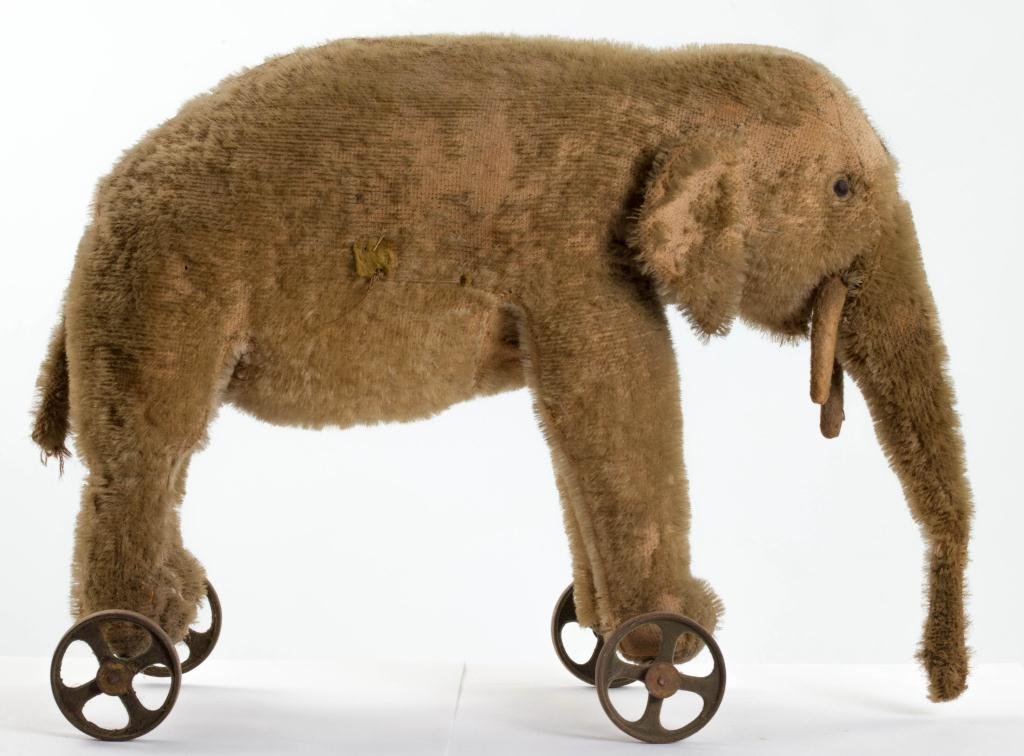 1910 stuffed elephant on wheels