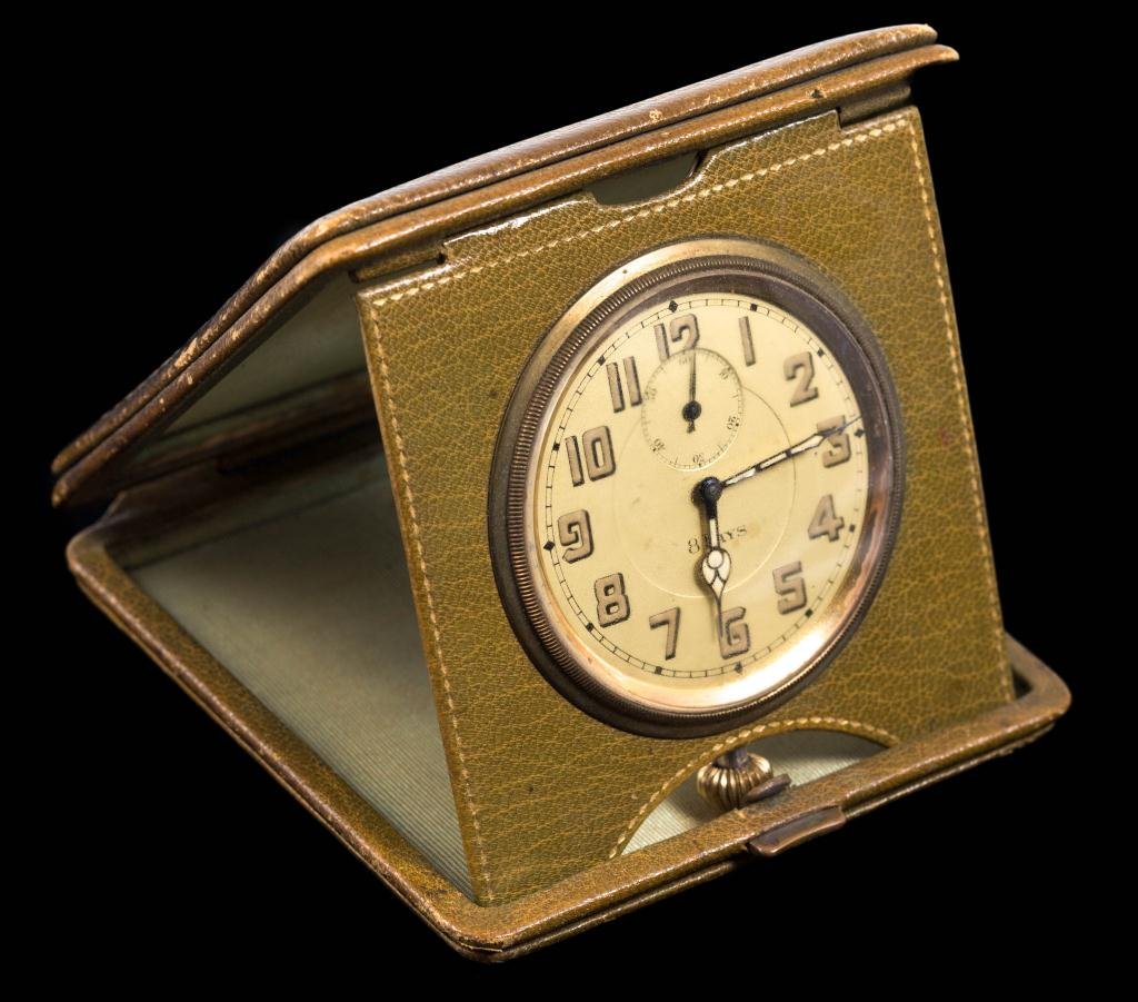 (8) Day Travel Clock in Original Case: Dial diameter 2 inches.