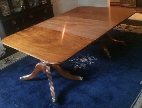 (19th /20th c.) Duncan Phyfe Style Dining Table: Mahogany with brass lion paw casters. 26 1/2 x 74 x 49 1/2 inches.