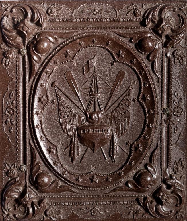 The Ship's Stern Civil War Era Thermoplastic Case: Containing 1/9 plate Ambrotype of infant in a fancy dress.