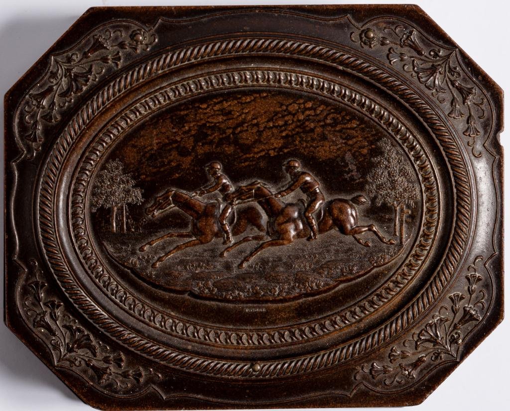 Very Rare1/4 plate Union case The Horse Race: Very rare quarter plate octagonal Union case The Horse Race (Krainik-86). Clipped cornered case contains a conforming 1/4 plate Ambrotype of woman. The mat is embossed Scovill Mfg. Co.