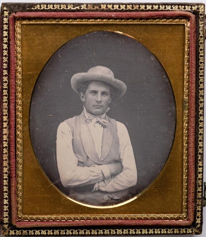 1/6 Plate Daguerreotype of Handsome Gentleman: Anonymous. Nicely posed in hat and vest with arms crossed. Oval mat. Nice case.