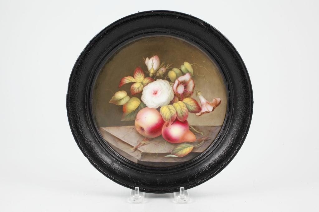 HAND PAINTED PORCELAIN PLAQUE WITH PLASTER FRAME: "Still life with Apple, Pear and Flowers" porcelain. unsigned. 7 inches diameter. 9 inch total diameter.