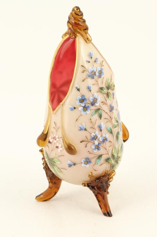 EGG-FORM ENAMELED GLASS VASE: Cranberry glass with hand painted light tan overlay highlighted with amber glass accents. Height 8 inches.