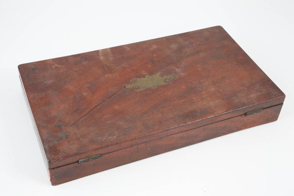 PRESIDENT JAMES MONROE DUELING PISTOL CASE: Velvet lined fitted mahogany case with brass cartouche engraved "J.M." Including: Powder flask, (2) bullet molds, barrel cleaner, lead shot, flints, wadding and (2) letter openers. Provenance: The Hoe
