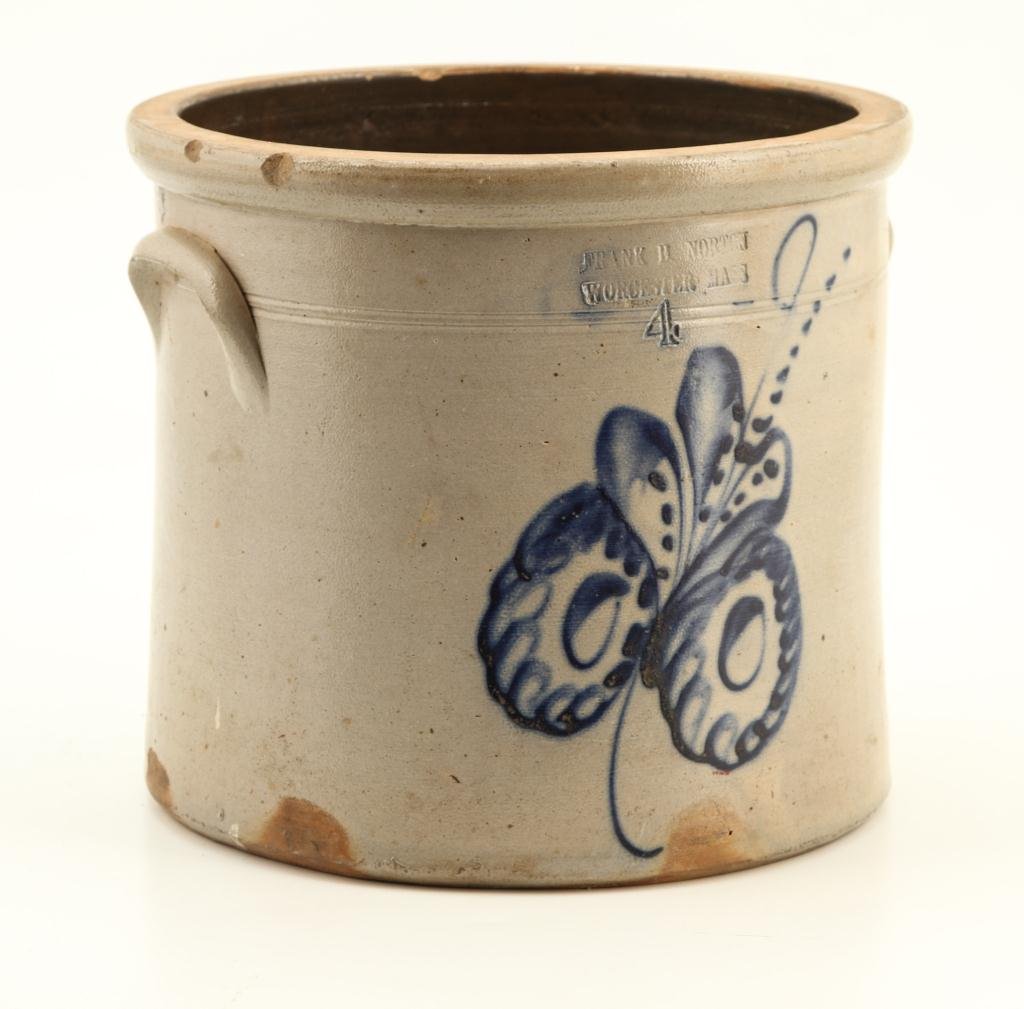 FRANK NORTON WORCESTER MASS STONEWARE CROCK: Embossed "Frank B. Norton Worcester Mass 4" gallon stoneware crock decorated with cobalt leaf. 11 x 12 inches