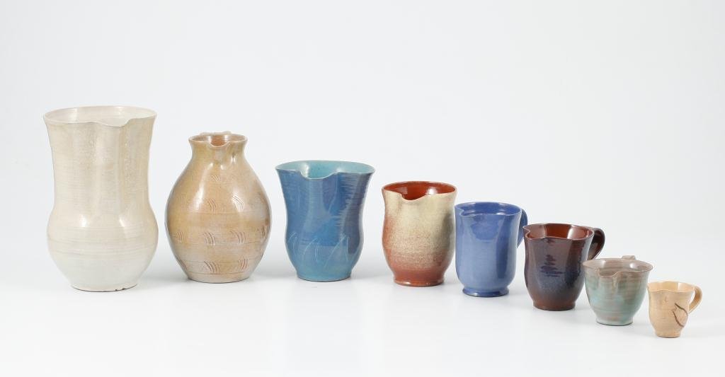 (8) EDWIN AND MARY SCHEIER GRADUATED PITCHERS: Assembled graduated set of creamers and pitches. Signed. Height 9 inches to 2 1/2 inches.