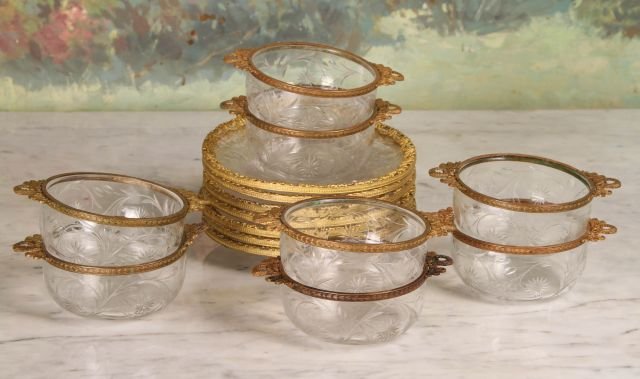 Set of Cut Glass Finger Bowls: Intaglio cut with ormolu border. 7 saucers and 8 bowls