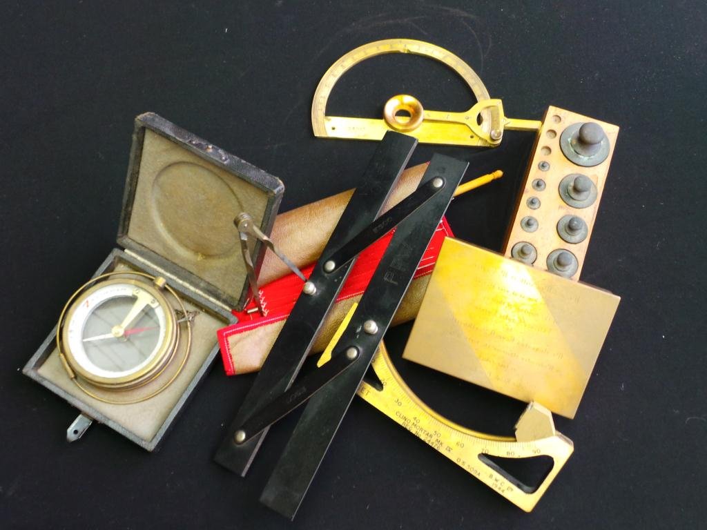 A Collection of Seven Nautical Objects: including compasses, measures, scale, weight