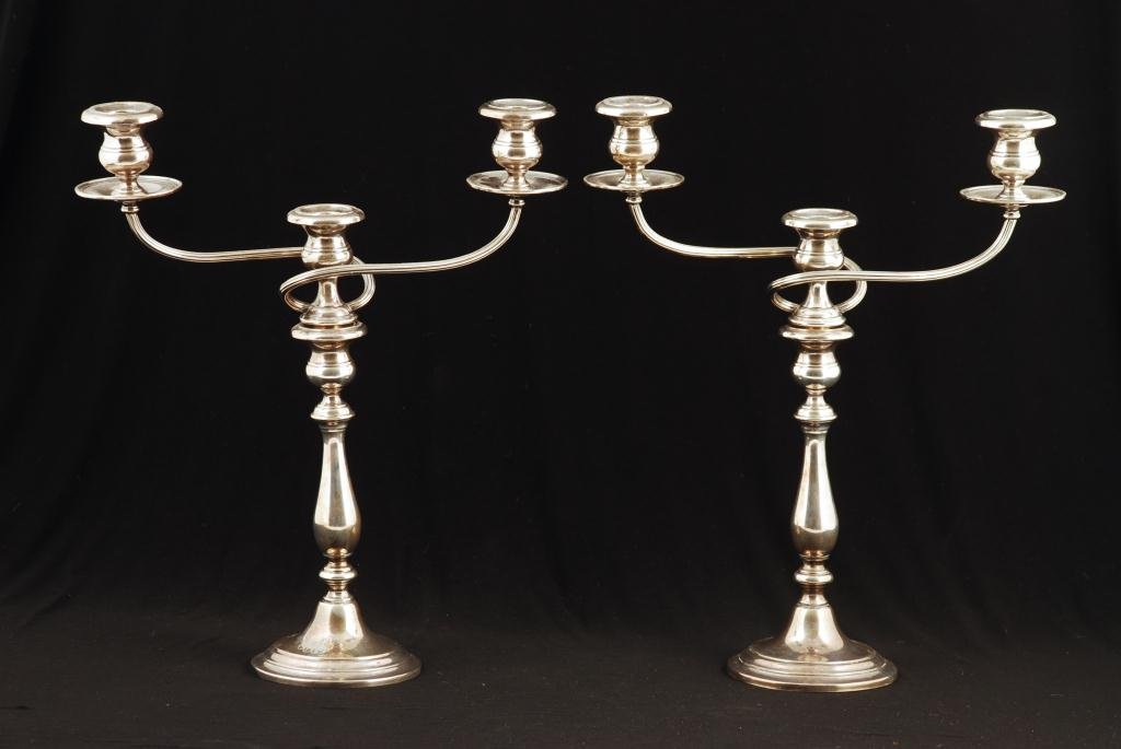 PAIR OF THREE-LIGHT SCROLL-ARM CANDELABRAS: Weighted sterling silver, monogrammed, 13 1/2 inches high.