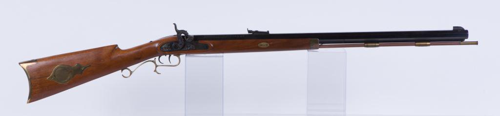 THOMSON CENTER ARMS PERCUSSION CAP RIFLE: 29 inch barrel, 45 cal, serial number 25114, made in Rochester, NH, brass patch box, butt plate, trigger guard, forearm cap and rod holders.