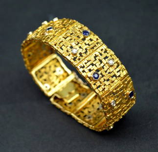 Modernist 18K Gold, Diamond & Sapphire Bracelet: Modernist 18K yellow gold, with white gold set Diamonds & Sapphires as a link Bracelet in the style of Andrew Grima marked "750" and "138 TO". Total weight 55G. Length 7 1/4 inches (18.5 cm.). See