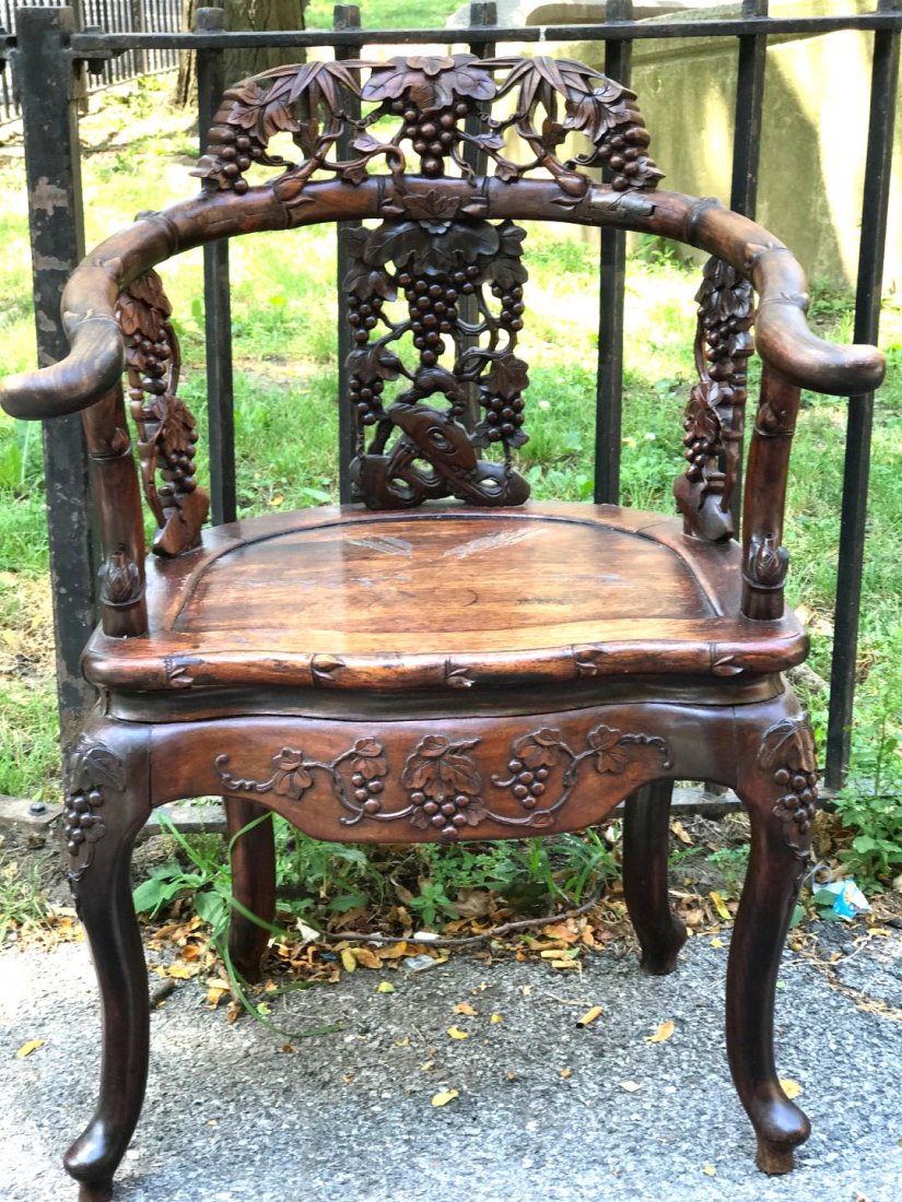 Good Chinese Carved Hardwood Arm Chair: Good Chinese Carved Hardwood Arm Chair, the back splat carved with squirrel and grapes; the curved arm detailed to resemble bamboo. Height 34 inches (86.5 cm.) X width 22 inches (55.8 cm.) X depth 18.