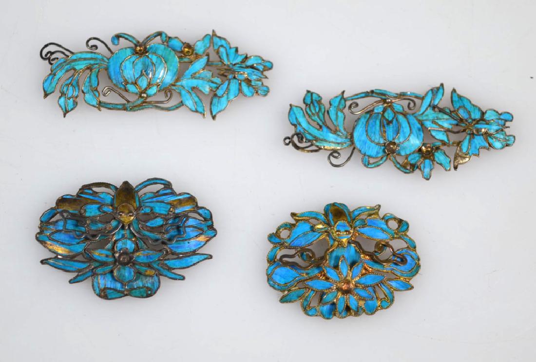 4- Chinese Feathered Silver-gilt Flower appliques: 4 Chinese Qing Dynasty Feathered Silver-gilt Flower appliques, the backs with silver marks. Age related wear, a few small parts missing, a few feather inlays missing. Width 2 inches (5.3 cm.).