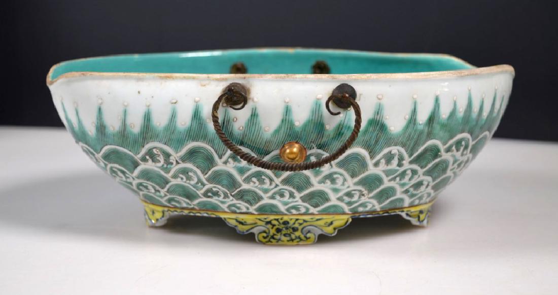 Chinese Guangxu Mark & Period Porcelain Bowl: Chinese Guangxu Mark & Period Porcelain Bowl with enamel decoration of waves around the four legs; old wrought bronze handles; the mark in underglaze blue on base. Side foot corner chipped. Width 9 1/