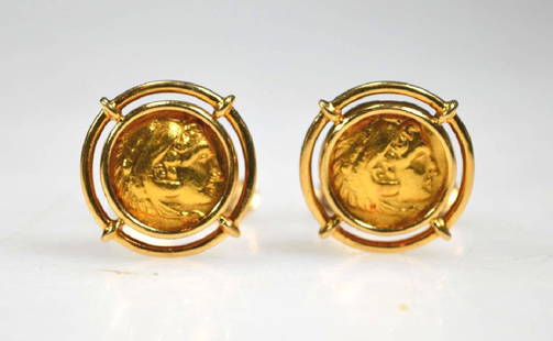 Ilias Lalaounis; Solid Gold Coin Cuff Links: Ilias Lalaounis, Greece; Solid Gold Coins each with the head of Heracles and set in yellow gold Cuff Link mountings each marked with the Company symbol, "Greece," "750," and 18K in Greek. Total weight