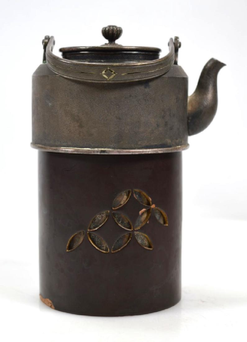 Japanese Silver Wine Warmer or Teapot: Japanese Silver Wine Warmer or Teapot with matching cover and with a carved black lacquer cover for the base; the pot with pierced bail handle and a revolving chrysanthemum bud finial. Light age relat