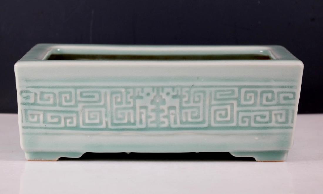 Chinese Qing Longquan Celadon Porcelain Planter: Chinese Qing Longquan Celadon Porcelain Planter, the four sides well carved with archaic confronting Dragon Scrolls under the thick glaze, the base with a 6-character Qianlong carved seal mark in a st