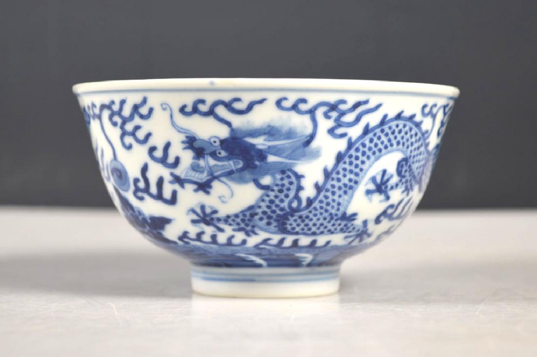 Fine Chinese Qing Blue Dragon Porcelain Bowl: Fine Chinese Qing Dynasty Underglaze Blue double Dragon Porcelain Bowl, the base with a Guangxu Mark in underglaze blue. Good condition. Diameter 4 1/4 inches (11 cm.).