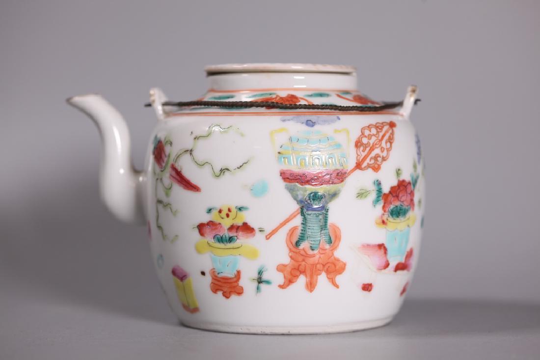 Chinese 19 Century Porcelain Teapot Bronze Handles: Chinese 19 Century Enameled Porcelain Teapot with a design of antiques and bats, the cover with a butterfly; the twisted Bronze bail Handles attached to porcelain flanges on shoulders. Light age relat