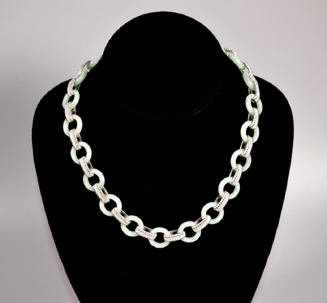 Judith Ripka Green Jadeite & Sterling Necklace: Judith Ripka Green Jadeite & Sterling Necklace with "JR" logo toggle closure, the silver marked "925". Good condition, one small bead missing from one end of toggle. Length 17 inches (43 cm.).
