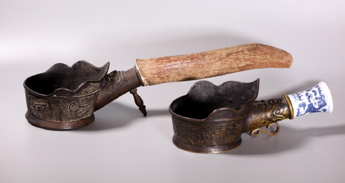Two Chinese Qing Dynasty Bronze Silk Irons