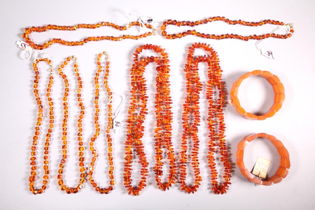 7 Amber Necklaces, 2 Amber Link Bracelets; 200G: 7 Amber Necklaces, 5 small beads knotted, 2 irregular shaped ropes knotted, together with 2 Amber Link Bracelets one with old Russian label, the other with partial label; total weight 200G. Length of