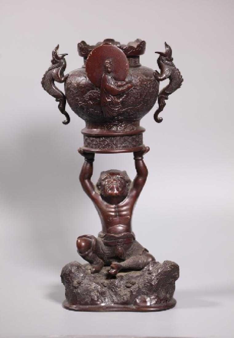 Japanese 19 C Bronze Incense Burner on "Oni" Base: Japanese 19 century Bronze Incense Burner with an image of Kannon with moon back and Dragon handles and raised on an "Oni" figure seated on a rock Base. Age related wear, base of incense burner drille