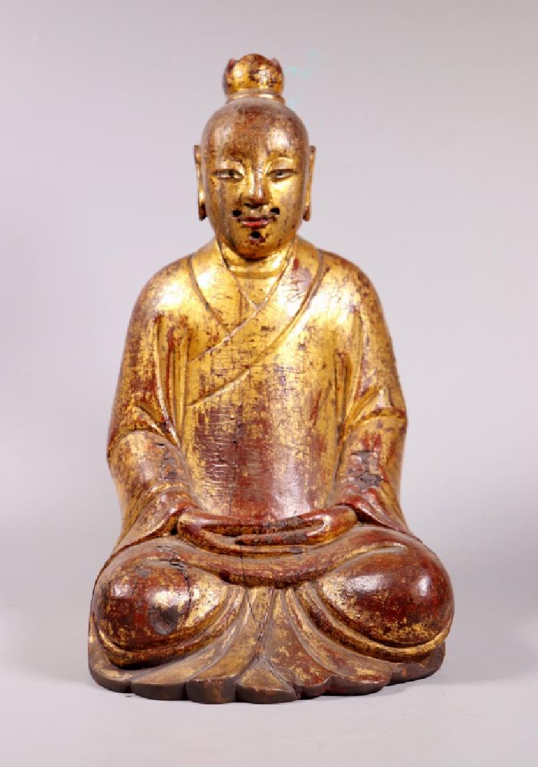 Chinese Daoist Ming Wood Figure; Gold & Lacquer: Fine & Rare Chinese Daoist Ming Dynasty Carved Wood Seated Figure with elongated fingers, all covered in Gold & Lacquer, the surfaces with "Lacquer Bursts". A few small age related shrinkage lines, sp