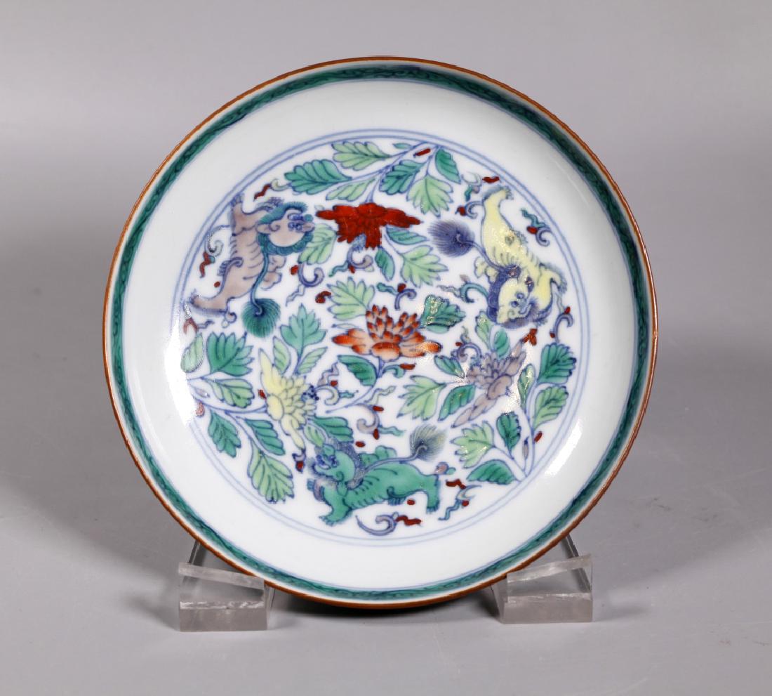Chinese Doucai Enameled Porcelain Low Bowl: Chinese Doucai Enameled Porcelain Low Bowl with a central design of 3 Buddhist Lions among scrolling flowers, base unglazed. Good condition with light age related wear, very tiny flake to brown edge. 