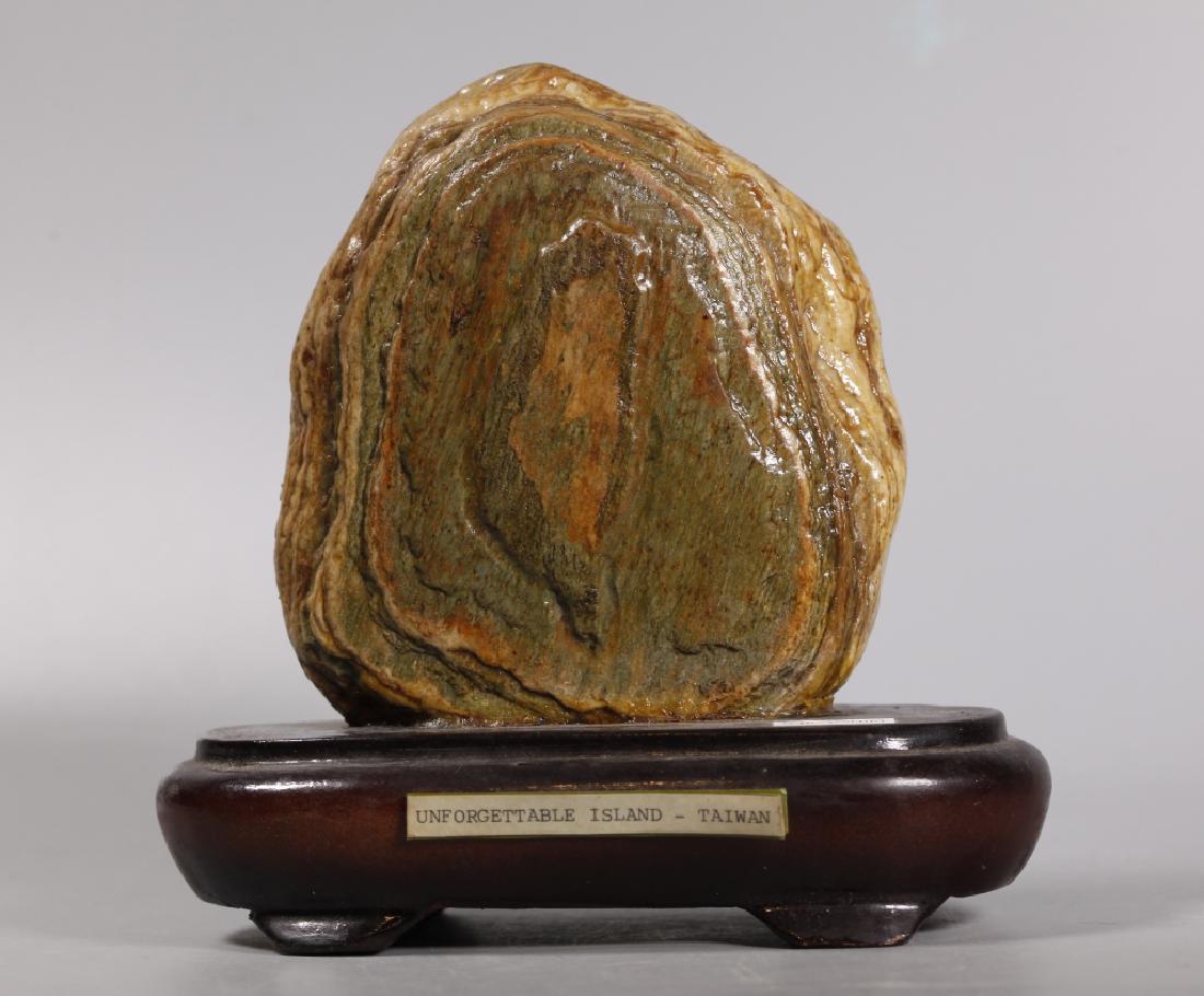 Chinese Taiwan Island Shaped Scholar's Stone: Chinese Taiwan Island Shaped Scholar's Stone mounted to hardwood stand labeled: "Come to the Marble Country / Hwa-Len on June 19, 1981", the front with a layer of marble shaped like the Island titled,