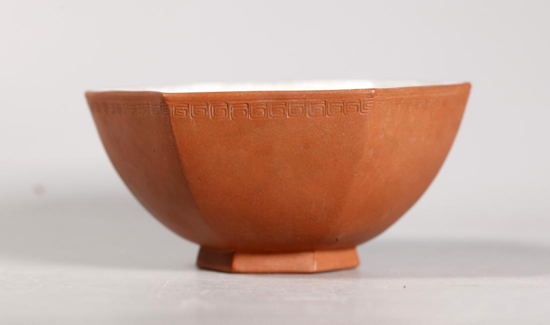 Chinese Crackle Enameled Yixing Teabowl Rice Bowl: Chinese Crackle White Enameled Yixing Hexagonal Teabowl or Rice Bowl, the outside left in the yixing clay with a cloud border impressed to top outside edge. Good condition with light age related wear.