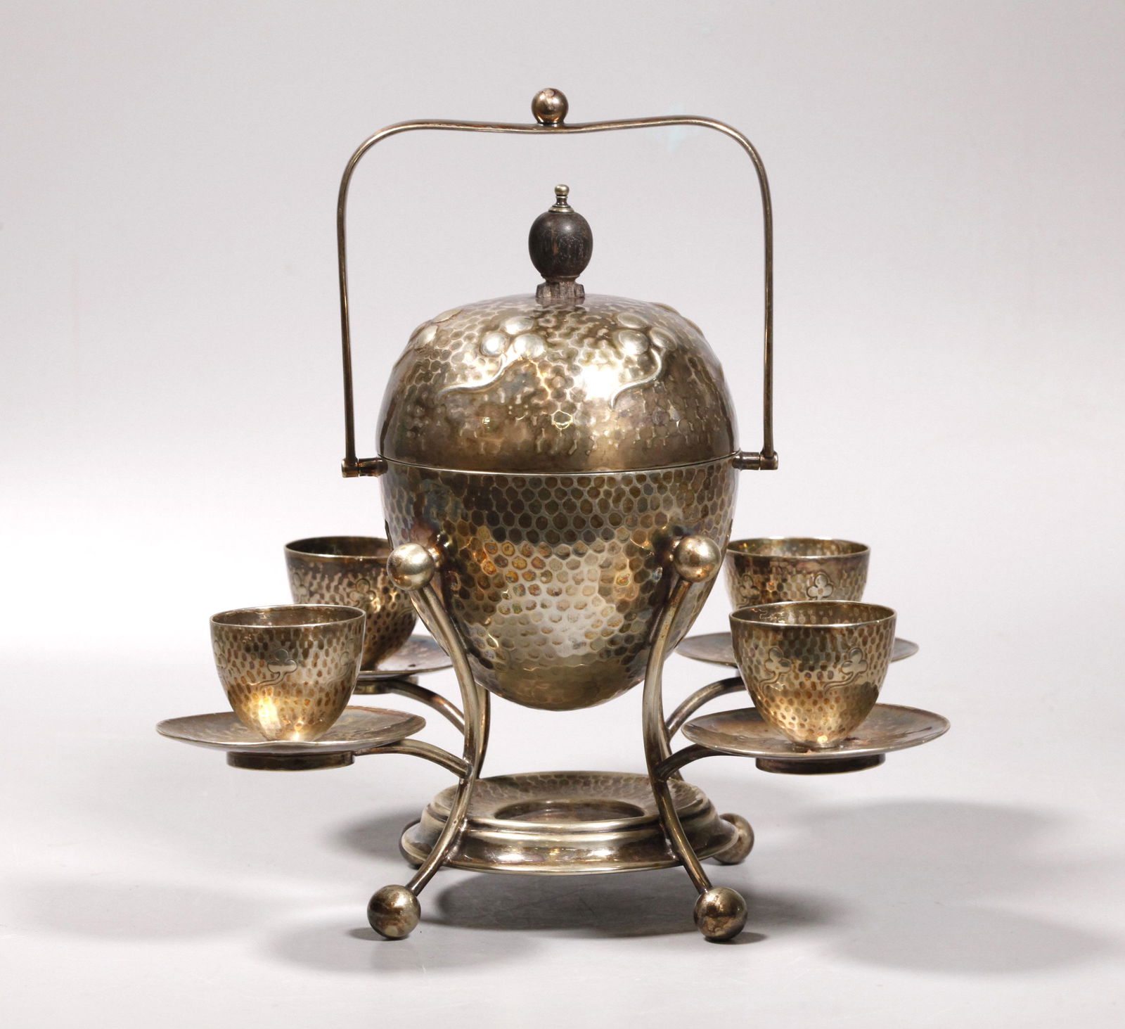 Mappin & Webb Asthetic Movement Silver Egg Server: Mappin & Webb Asthetic Movement Silver Egg Server with 4 egg-cups mounted to small plates and fitted into 4 arms around an egg-shaped centerpiece with swing arm handle on 4 legs with removable cover w