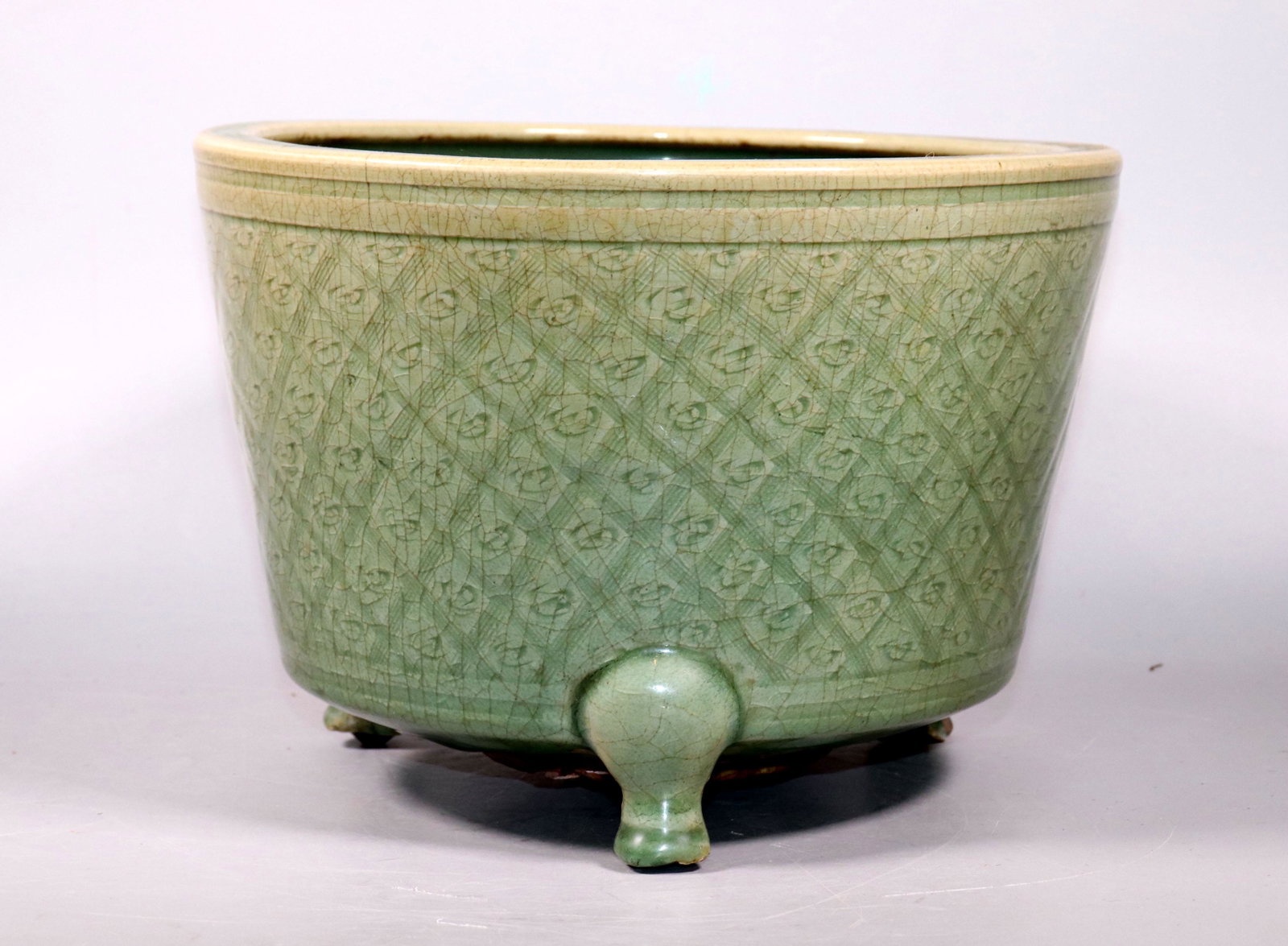 Lg Chinese Ming Dynasty Longquan Porcelain Censer: Large Chinese Ming Dynasty Longquan Crackle Porcelain Censer with 3 applied feet around a flat unglazed base, incised to the sides with a basket-weave design in a rich green celadon. Base with origina
