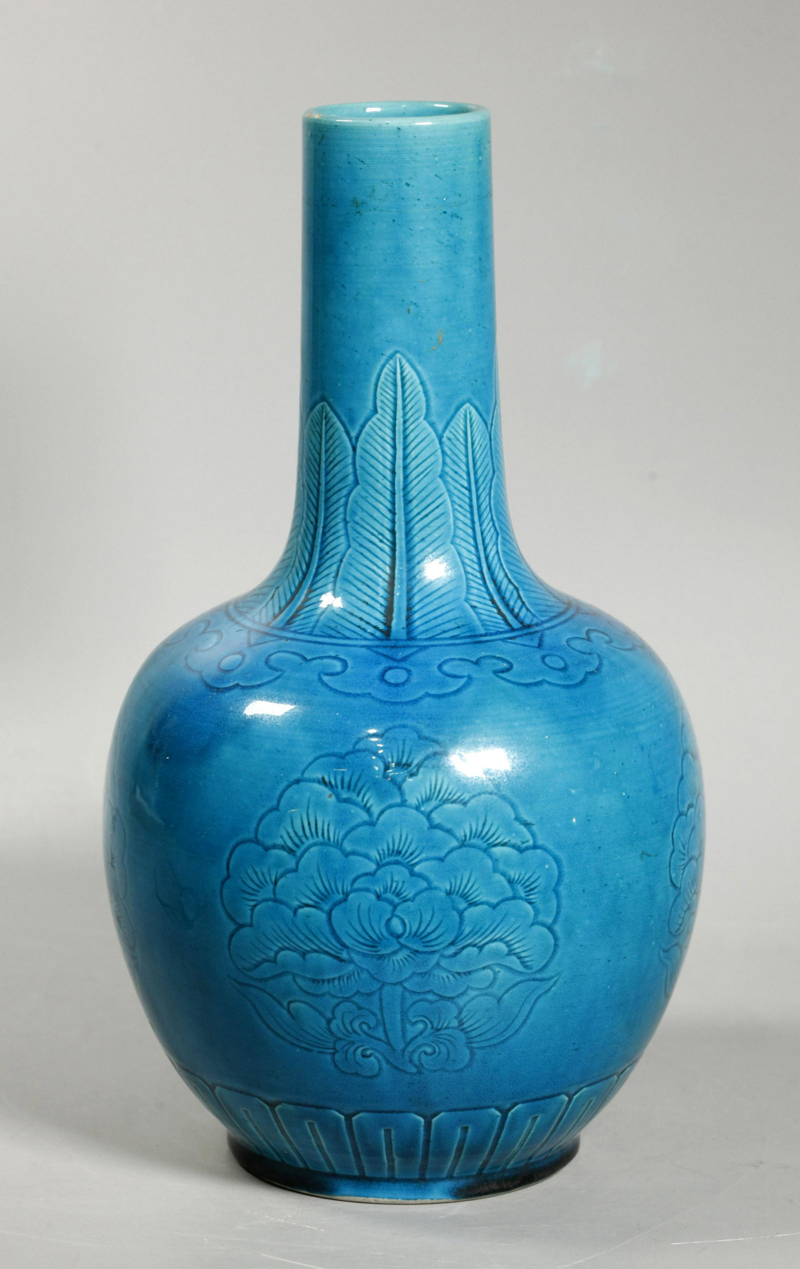 Chinese Jingdezhen Mark Turquoise Porcelain Vase: Chinese Jingdezhen Mark Turquoise glaze over biscuit Porcelain Vase with a carved design of large peonies, ruyi cloud collar and leaf border to neck, the unglazed base burned buff in the kiln with an 