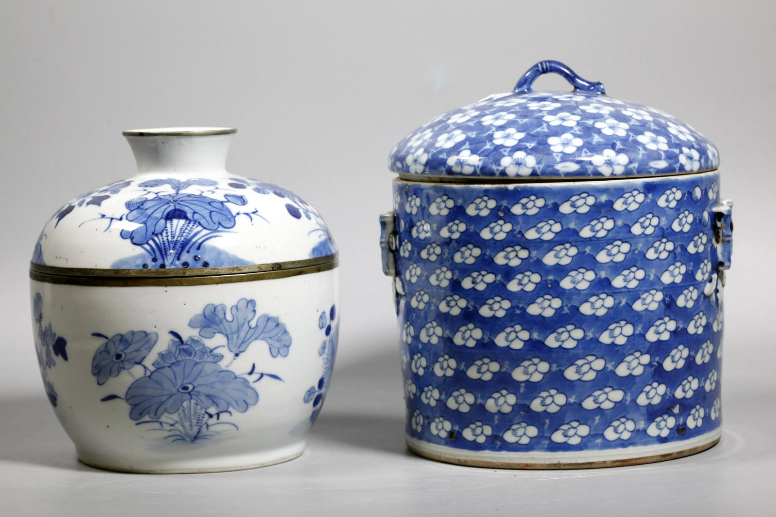 2 Chinese 19 C Blue & White Porcelain Covered Pots: 2 Chinese 19 Century Blue & White Porcelain Covered Pots; the first in Brush Pot Shape with a design of Prunus Buds on Cracked Ice with applied "bamboo" hooks to sides for handles and another as finia