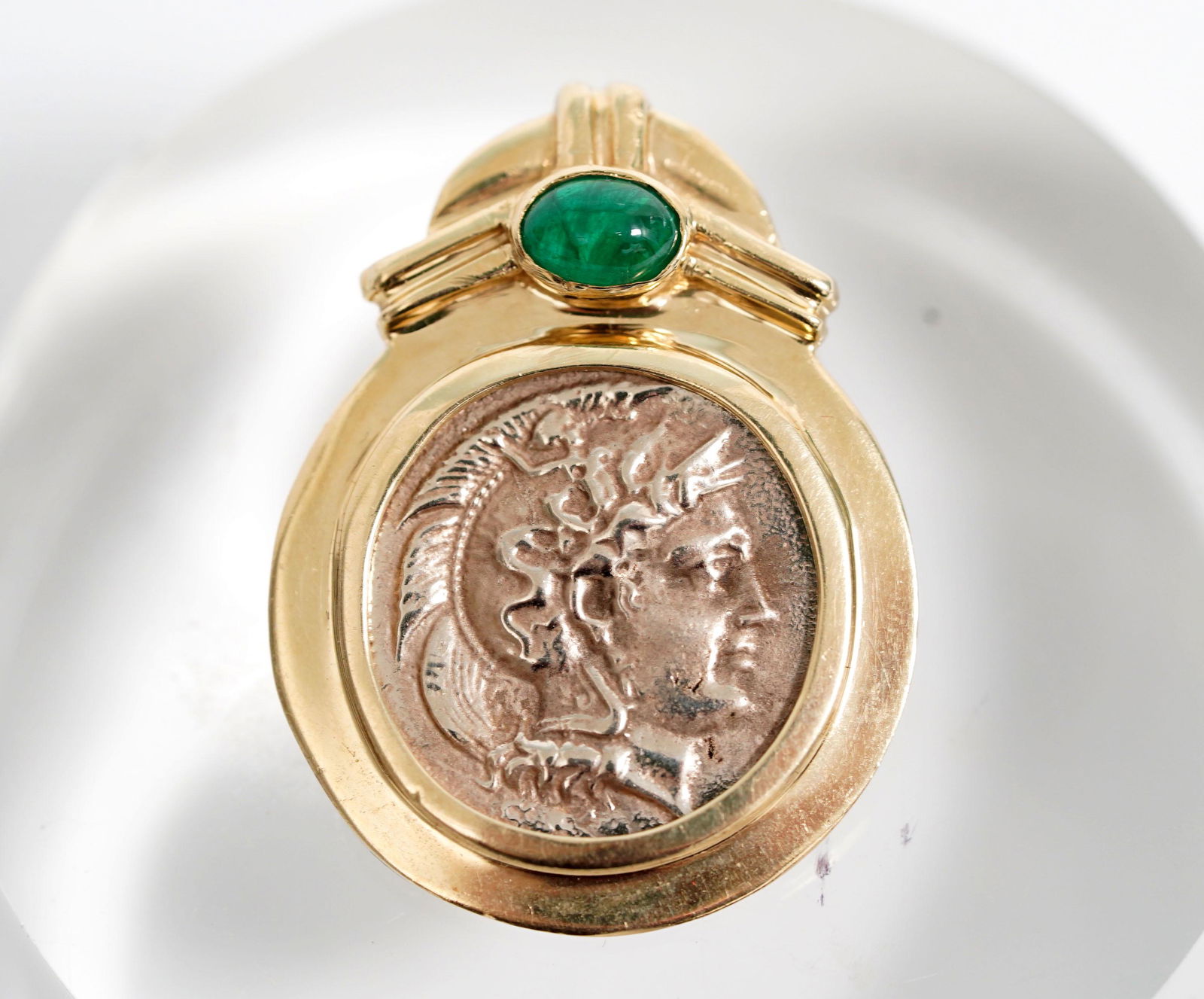 Designer's Emerald and "Ancient Coin" Pendant 14K: Vintage designer's emerald and "ancient coin" pendant in 14K. Height 1 3/8 inches (3.5cm). Weight 12.1 grams. Good condition with light age related wear. ______________________________________________