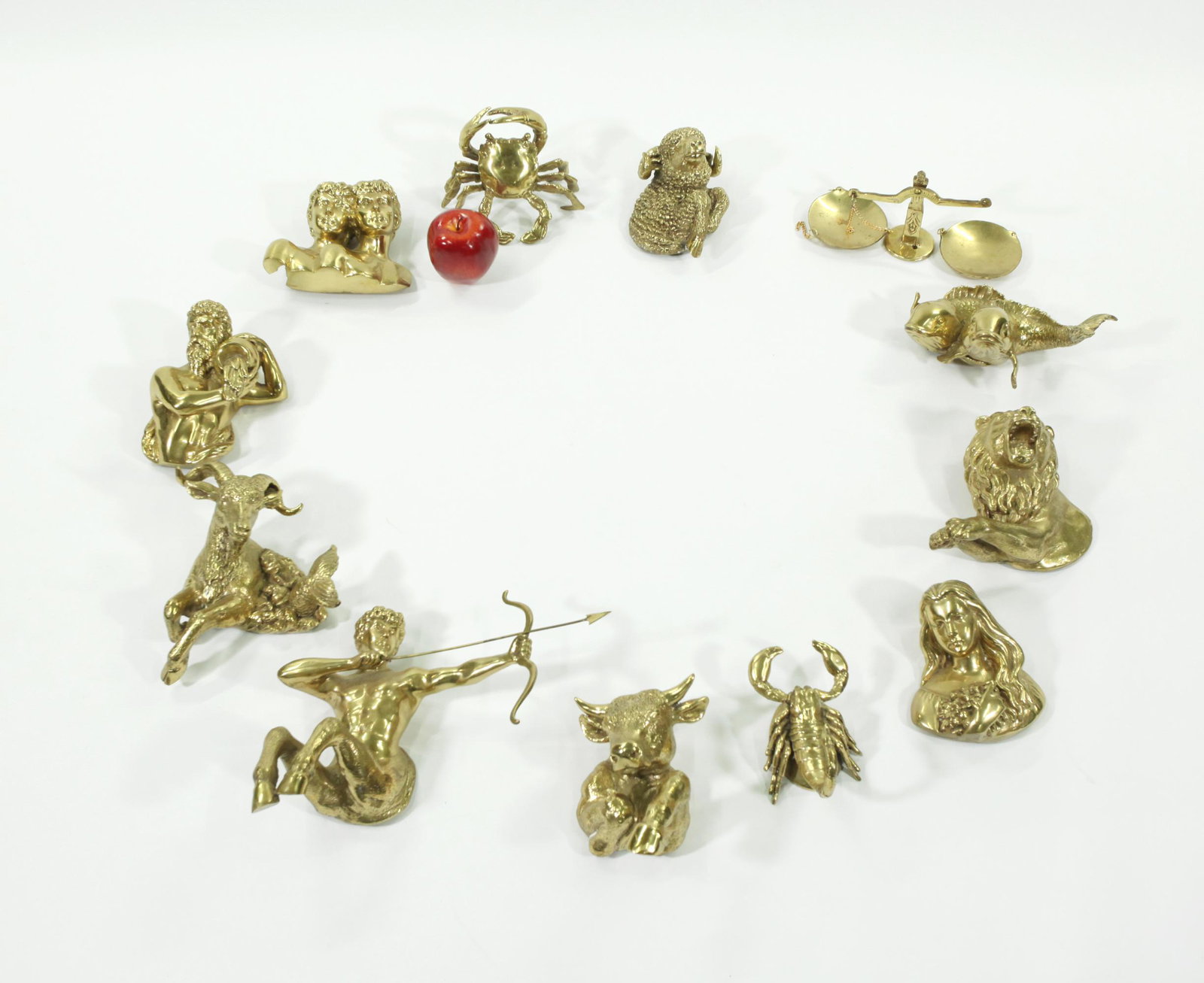 Polished Brass 12 Symbols of Zodiac Wall Sculpture: Vintage Polished Brass "12 Symbols of the Zodiac" Wall Sculpture; can be used with a clock center to size. Good condition. Height of Sagittarius symbol 9 1/2 inches (24 cm.) X width 12 1/4 inches (31 