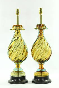 Pr Hollywood Regency Seguso Murano Marbro Lamps: Pair of Hollywood Regency Murano lamps made by Seguso for Marbro Lamp Company in a peridot green with aquamarine glass overlay on an ebonized wooden base. Good condition with age-appropriate wear. The